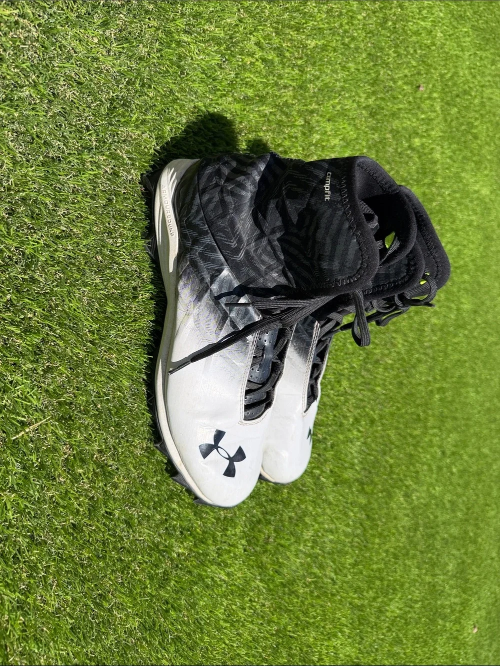 Under Armour Men’s White and Black High-Top Athletic Cleats